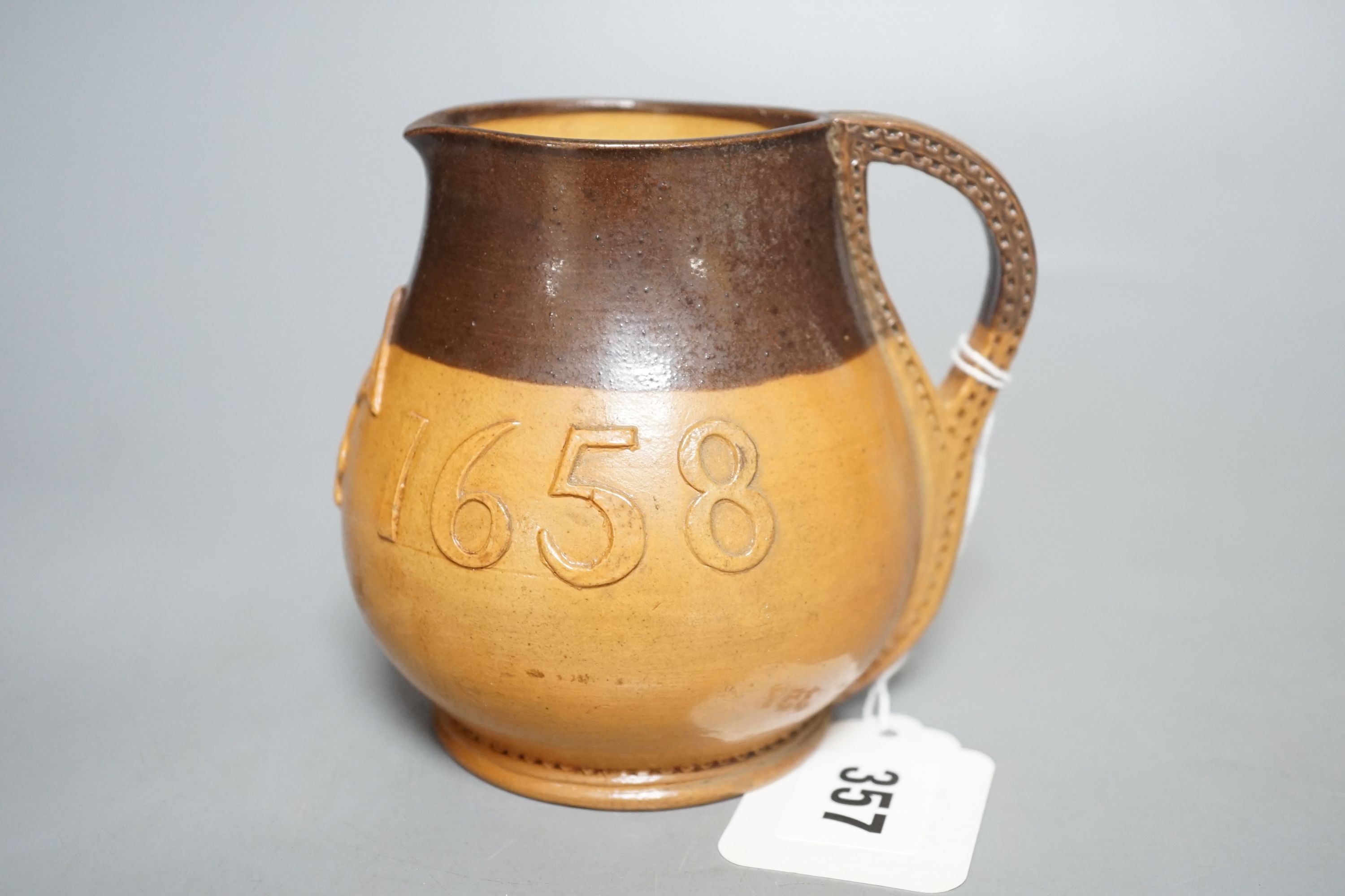 An early 19th century English pearlware plate and a Doulton Salisbury Gill jug, 11cm tall